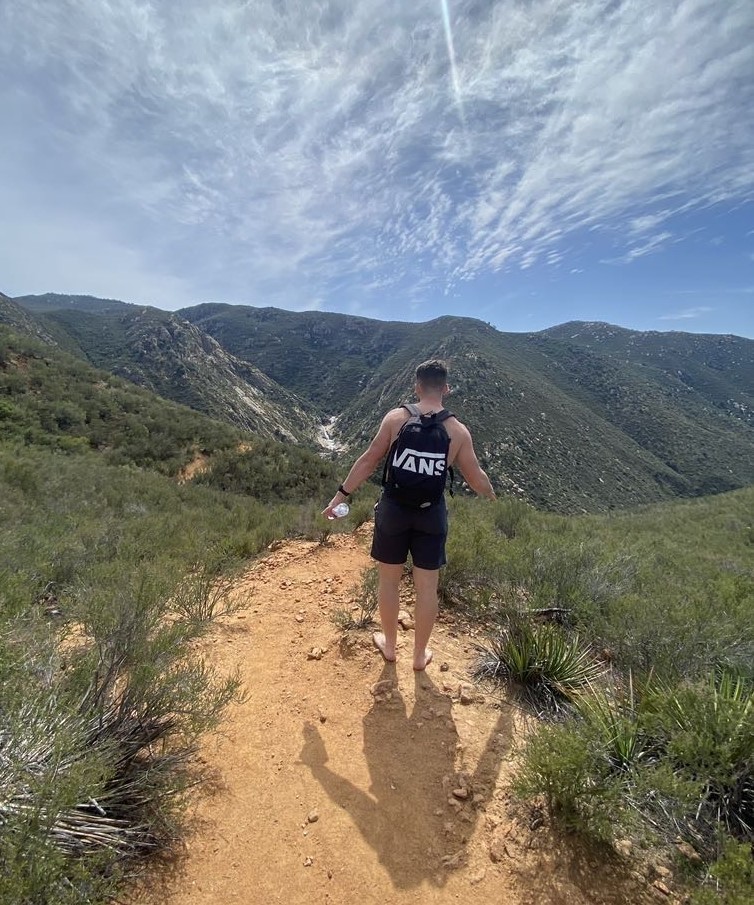 Ethan Bible hiking a mountain trail in San Diego